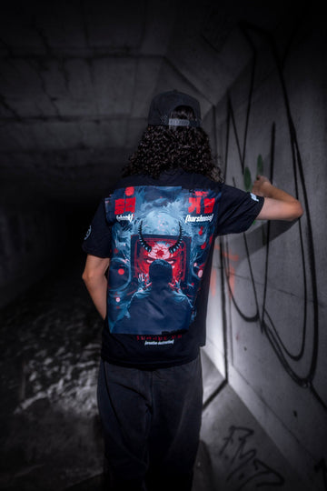 Male model back view wearing the Dark Matter Threads Dark Matter Tracks black unisex t-shirt with graphic artwork, Ponda collaboration.