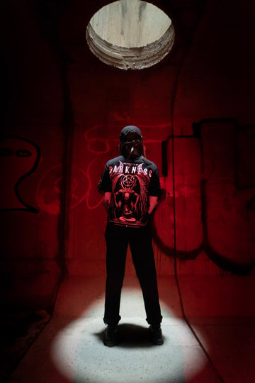 Female model back view wearing the Dark Matter Threads graphic print Protected unisex t-shirt, 100% cotton.